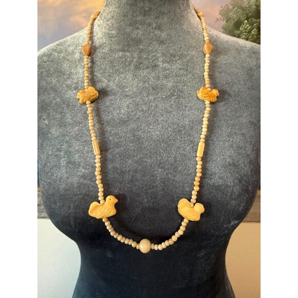 Jewelry - vintage necklace featuring wooden carved animal-shaped pendants and beads